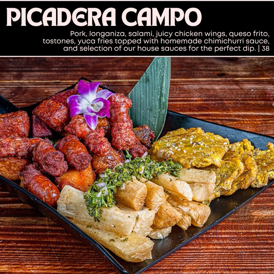 A platter of fried pork, longaniza, chicken wings, queso frito, tostones, and yuca fries with chimichurri.