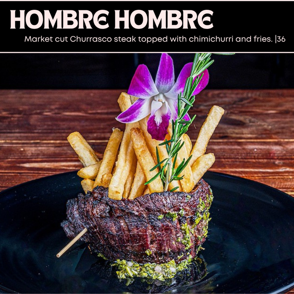Market cut Churrasco steak topped with chimichurri and fries, garnished with an orchid and rosemary.