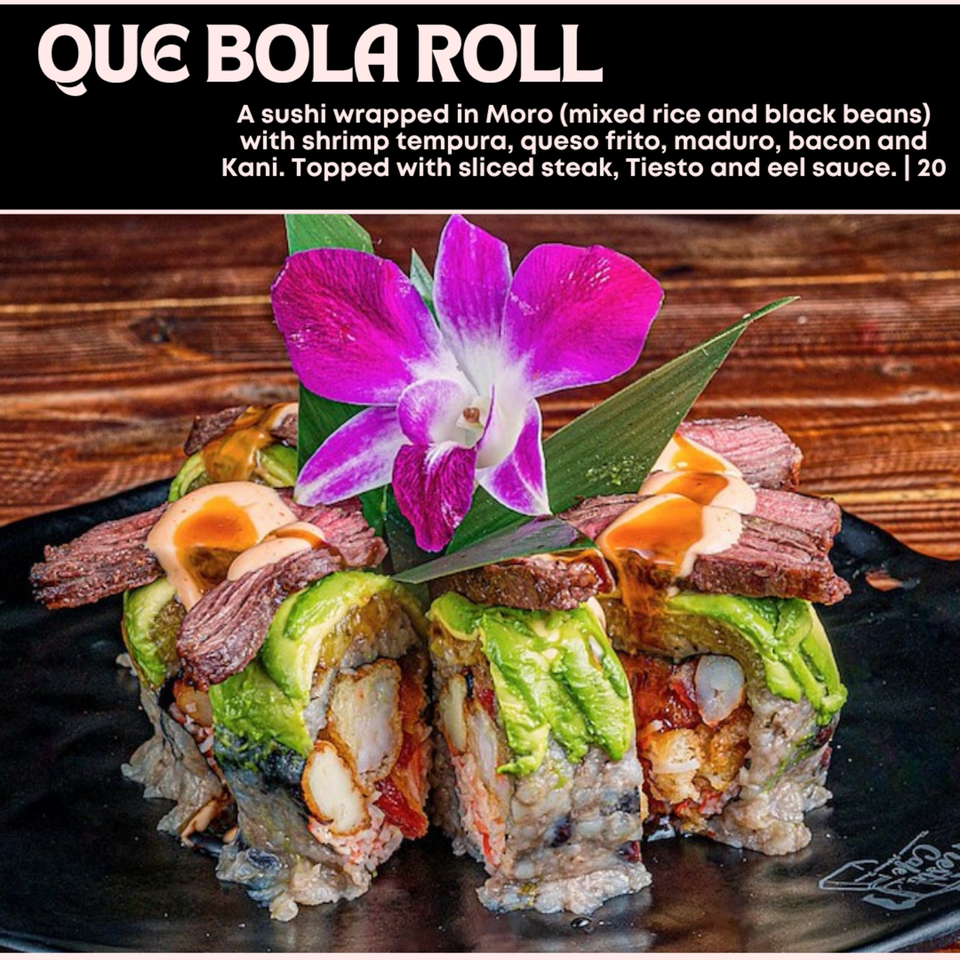 Que Bola Roll sushi with shrimp tempura, queso frito, maduro, bacon, kani, sliced steak, and sauces.
