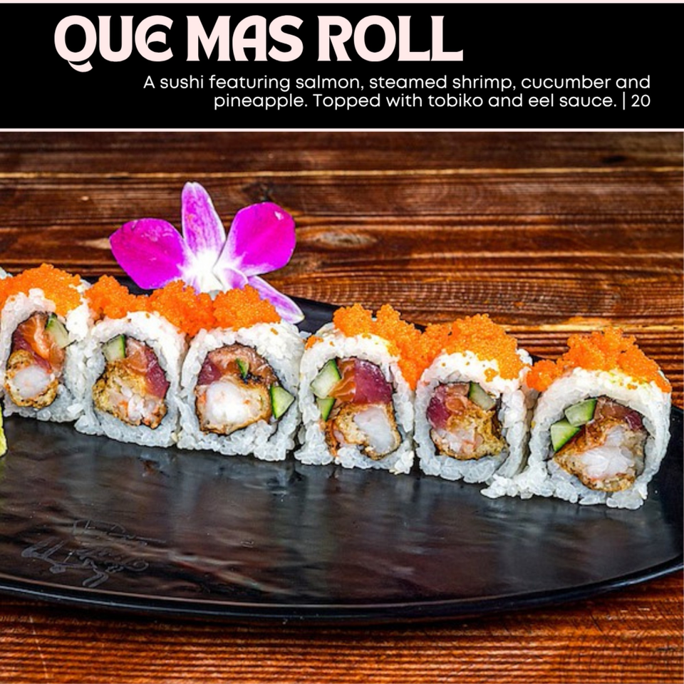 Que Mas Roll sushi with salmon, shrimp, cucumber, pineapple, tobiko, and eel sauce on a black plate.